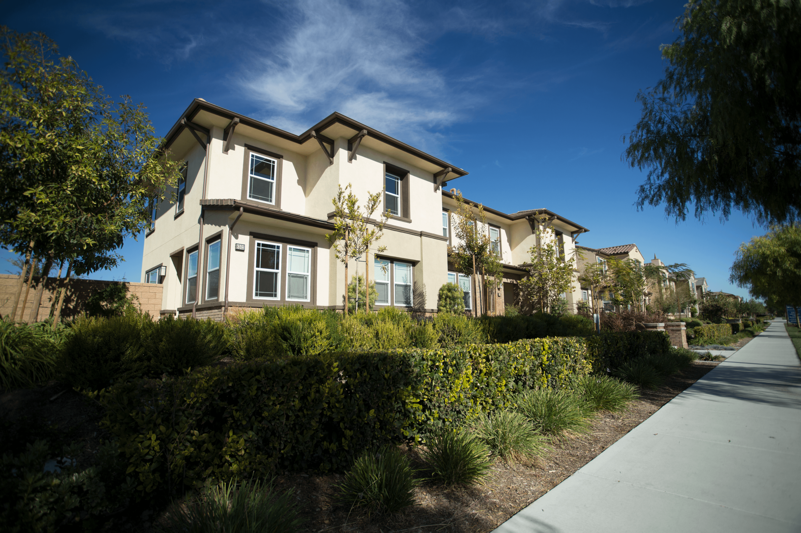 Chino Housing with carefully trimmed hedges and greenery